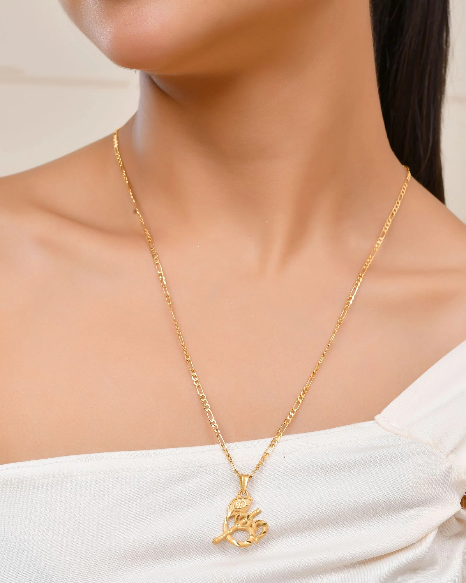 Jewels Nest Gold-Tone Flute Om Pendant Necklace For Women - Image 2